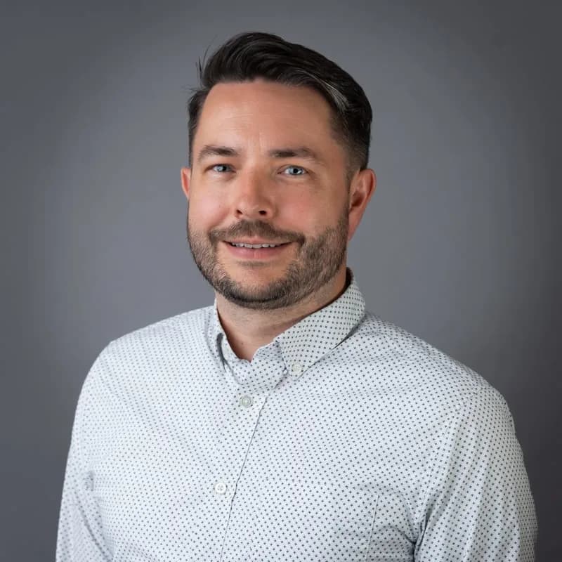 Professional headshot of Andrew Duff